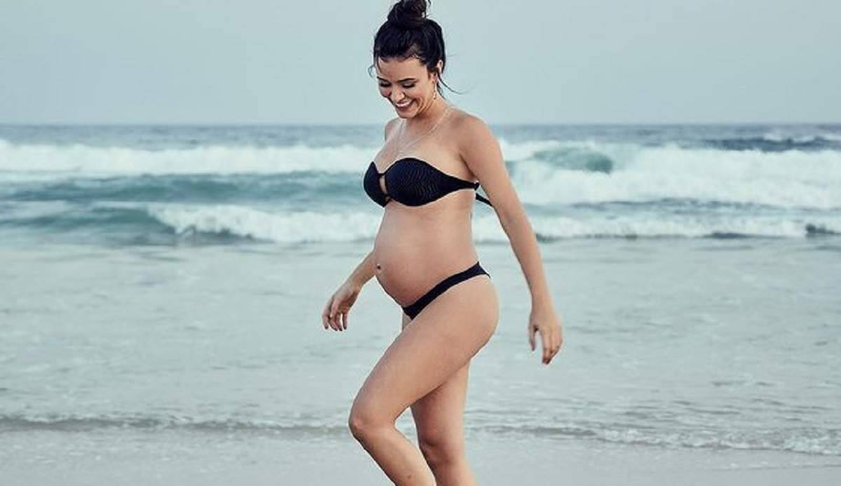 No ar em Malhação, Talita Younan exibe a gravidez em ensaio fotográfico na praia